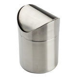A small, cylindrical Mini Waste Basket crafted from stainless steel features a shiny, brushed finish and a semi-circular swing-top lid for easy disposal. Perfect for countertop use, its modern, minimalist design stands out against the plain white background.