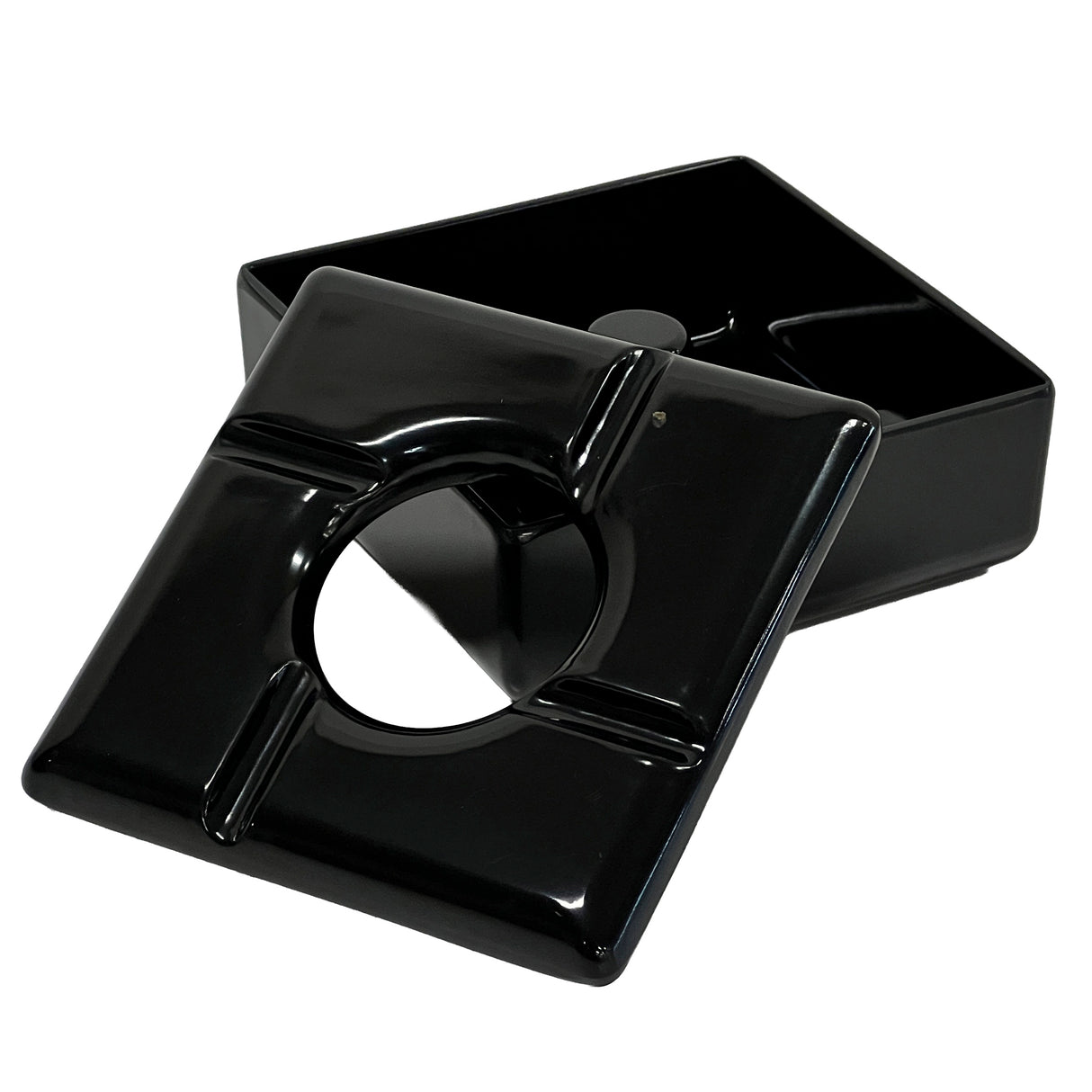 A black, square windproof ashtray with a removable lid. The lid features a central round opening and four notches for holding cigarettes. The deep melamine ashtray beneath is dishwasher safe and designed to catch ashes and butts.
