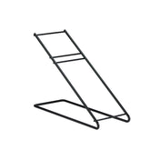 A black metal Angled Stand with a minimalist, wire black frame. It features two parallel rods forming a sloped surface, supported by a rectangular base with Dispense-Rite style horizontal bars connecting the sloped rods. The background is white.