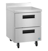 A stainless steel worktop refrigerator kitchen drawer unit with 2 drawers, black handles, and four wheels for mobility. The flat top is ideal for food prep or equipment, and a small blue and white certification label sits on the lower right corner.