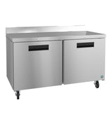 This commercial stainless steel worktop refrigerator features two solid doors, black handles, four caster wheels, and a flat top with a short backsplash. Its ENERGY STAR rating and sleek design make it ideal for busy commercial kitchens.