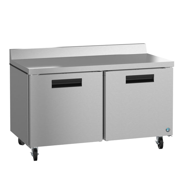 A sleek, industrial Hoshizaki Steelheart Series worktop refrigerator with two doors, four wheels for mobility, recessed handles, and a distinctive round blue logo on the bottom right corner. Perfect for any commercial kitchen setup.
