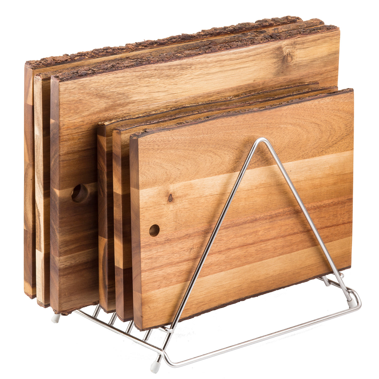 Four rectangular wooden cutting boards with natural bark edges are stacked upright in a stainless steel cutting board rack with a triangular frame. The boards vary in size and have visible wood grain patterns, each featuring a small hole near one corner.