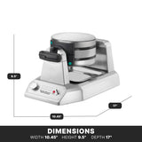 A stainless steel Belgian waffle maker with a rotating handle sits on a counter. Labels indicate its dimensions: 9.5 inches high, 17 inches deep, and 10.45 inches wide. Control knob and indicator lights are on the front panel.