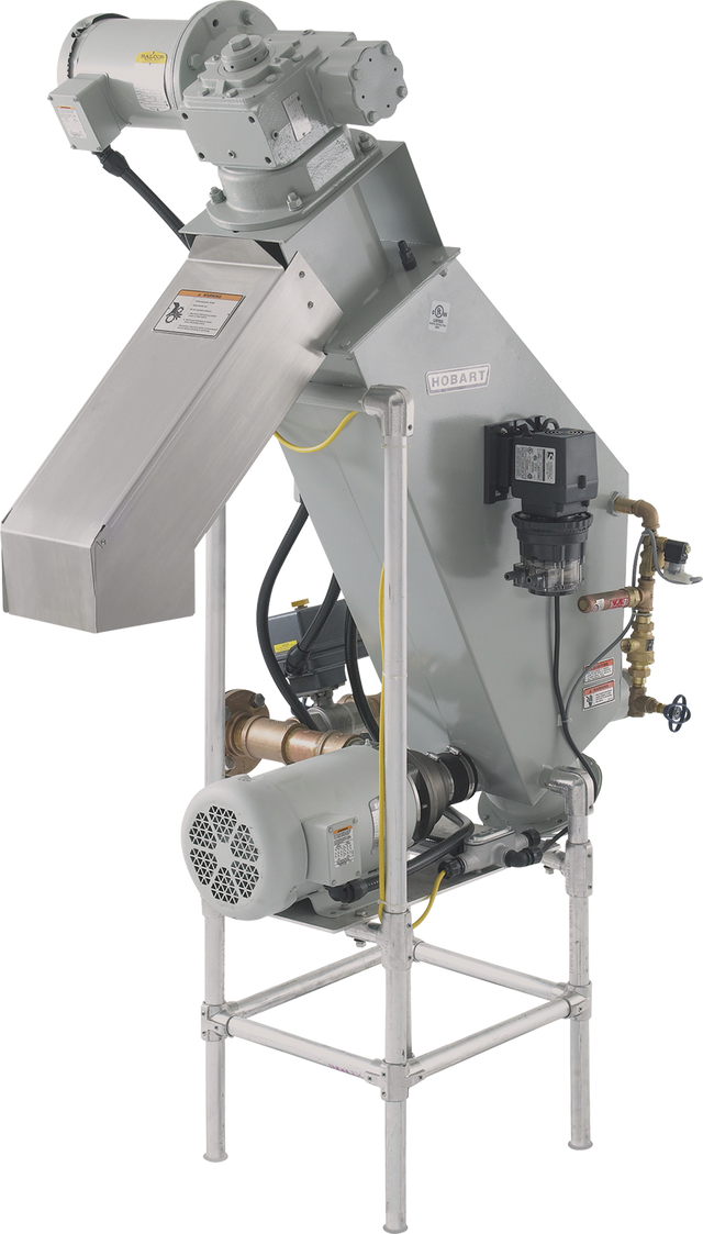 A large, industrial Hobart food waste disposer with a 6 inch metal chute, various pipes and valves, a motor at the base, control box, and warning labels, mounted on a metal frame with visible wiring and structural supports.