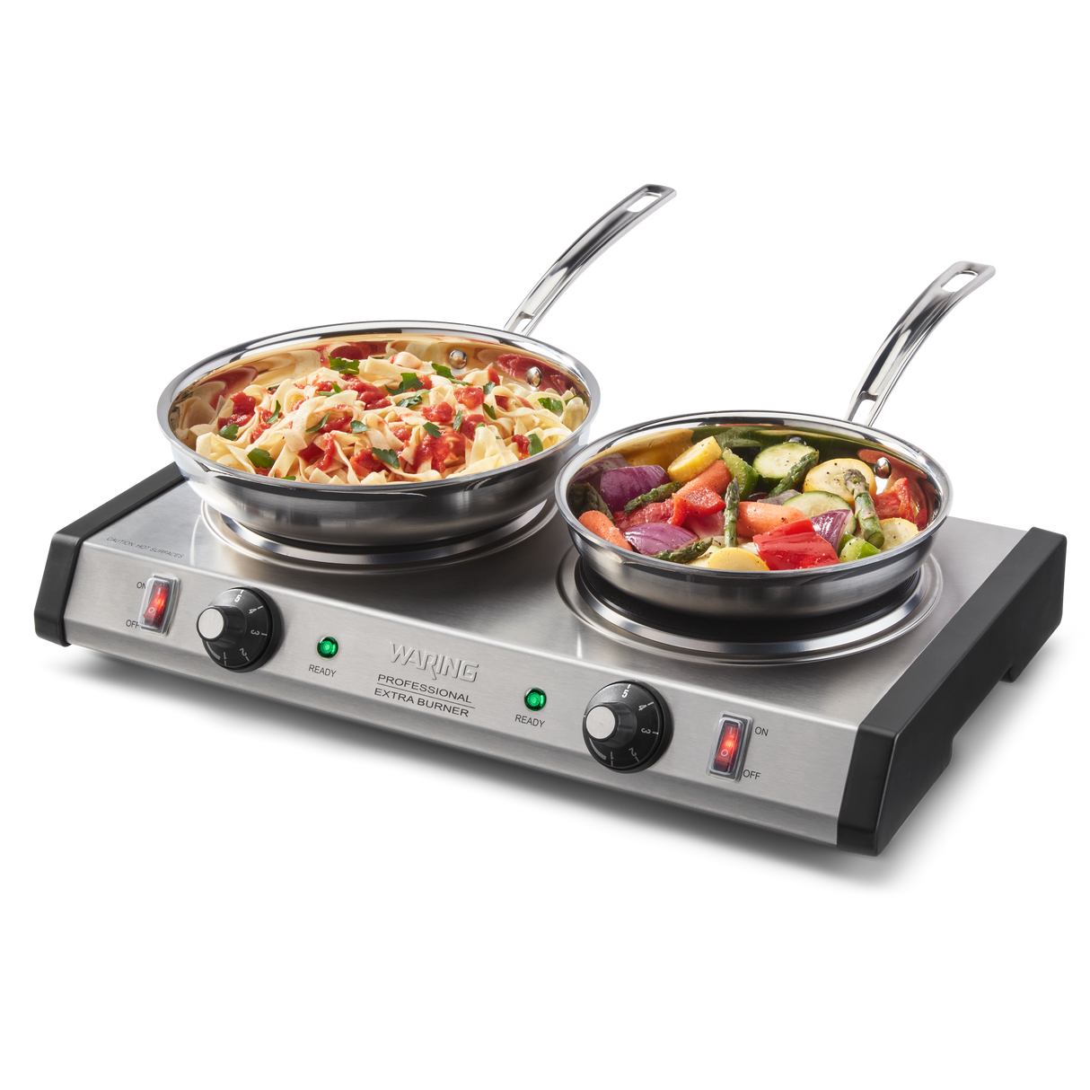 A double-burner stainless steel electric cooktop features two pans: one with cooked pasta and vegetables, the other with chopped mixed veggies. The front panel’s control knobs and red indicator lights make this commercial burner easy to use.