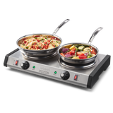 A double-burner stainless steel electric cooktop features two pans: one with cooked pasta and vegetables, the other with chopped mixed veggies. The front panel’s control knobs and red indicator lights make this commercial burner easy to use.