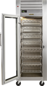 A commercial stainless steel reach-in refrigerator with a glass door is open, revealing multiple empty wire racks inside. The fridge stands on wheels, features a digital temperature display and control panel at the top, and has the interior light turned on.