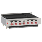 This Wolf commercial gas charbroiler features six red control knobs, black grill grates, and a durable stainless steel body. The raised back and sides enhance safety, while the unit stands on four legs with the brand logo displayed on the front left panel.