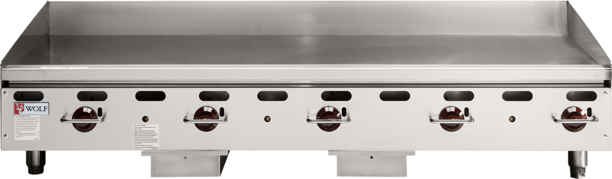 A large, heavy duty griddle, the Wolf AGM60_NAT features six red control knobs on its front panel. This commercial gas griddle boasts a clean, reflective flat surface and backsplash, with the Wolf logo displayed on the left side.