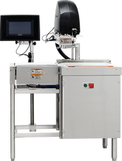 A Hobart stainless steel industrial checkweigher with a conveyor belt, digital display screen on the left, and black equipment housing on top. Warning labels and control buttons are visible. The sturdy stainless steel construction stands on metal legs.