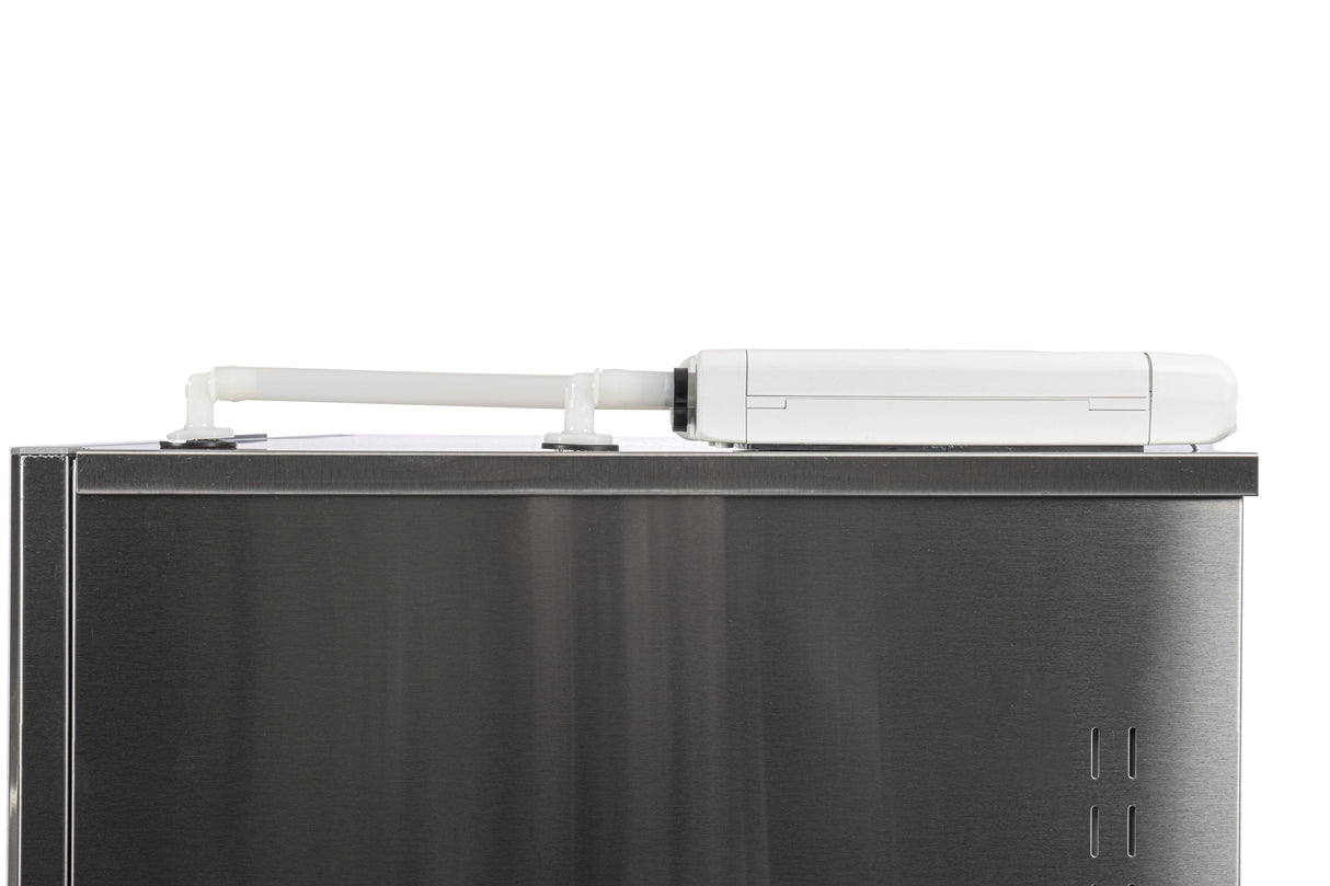 A close-up of the top of a Scotsman stainless steel appliance with a white, rectangular device attached via white brackets, set against a plain background. The device, used in modular cube ice machines, appears to have an extendable or adjustable arm.