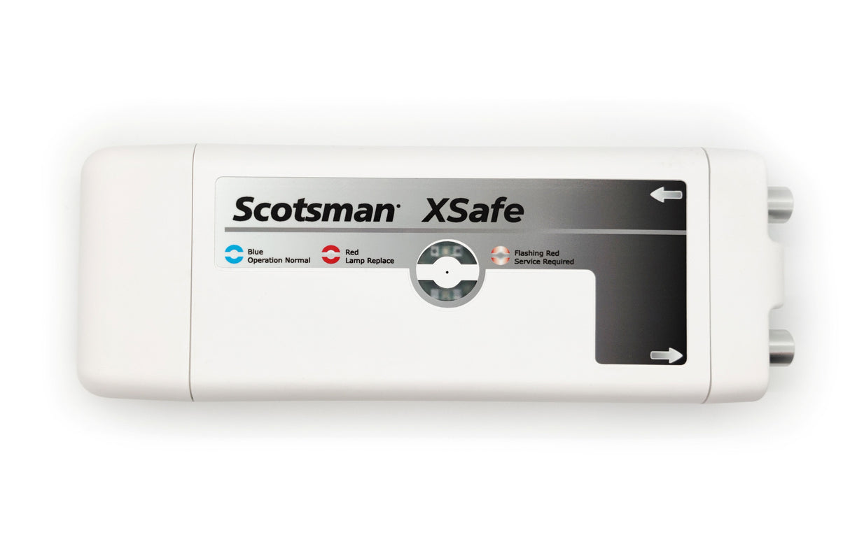 A rectangular white device labeled Scotsman XSafe Sanitation System features a status panel with blue, red, and flashing red indicators for normal operation, lamp replacement, and service required. Two gray connectors are visible on the right side.