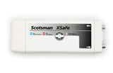 A rectangular white device labeled Scotsman XSafe Sanitation System features a status panel with blue, red, and flashing red indicators for normal operation, lamp replacement, and service required. Two gray connectors are visible on the right side.