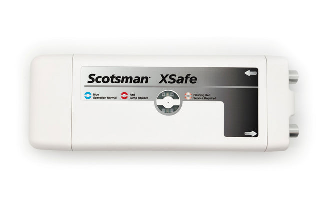 A rectangular white device labeled Scotsman XSafe Sanitation System features a status panel with blue, red, and flashing red indicators for normal operation, lamp replacement, and service required. Two gray connectors are visible on the right side.