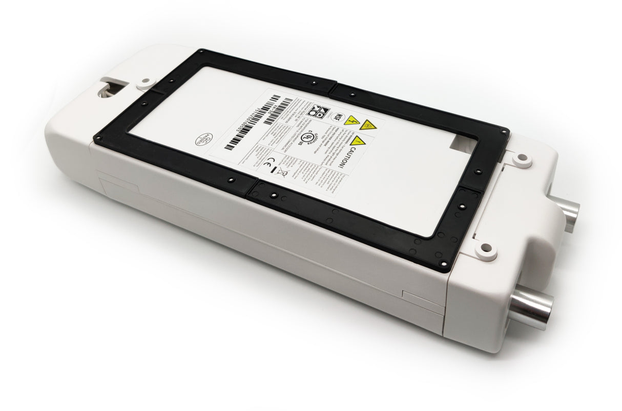 A rectangular white electronic device for modular cube ice machines features a large black-bordered label with barcodes, safety icons, and warning triangles. Perfect for use with the XSafe Sanitation System to enhance ice machine sanitation.