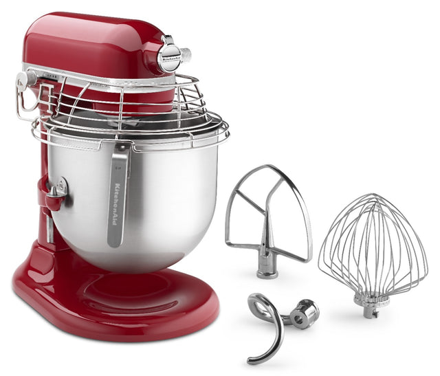 A shiny red KitchenAid Commercial Stand Mixer with a large 8 quart stainless steel bowl and protective guard, accompanied by three metal attachments: a flat beater, wire whisk, and dough hook—all arranged on a white background.