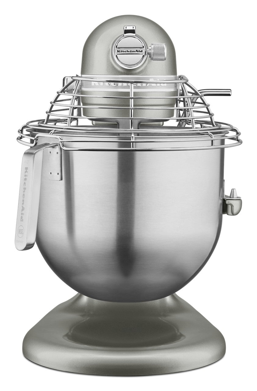 A metallic silver KitchenAid Commercial Stand Mixer with an 8 quart bowl and protective wire guard attachment is viewed from the front. The sturdy base and side lever allow easy bowl position adjustments for professional baking tasks.