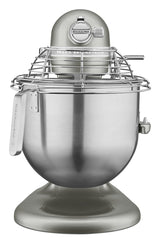A metallic silver KitchenAid Commercial Stand Mixer with an 8 quart bowl and protective wire guard attachment is viewed from the front. The sturdy base and side lever allow easy bowl position adjustments for professional baking tasks.