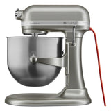 A metallic silver KitchenAid Commercial Stand Mixer with a large 8 quart stainless steel mixing bowl attached. The mixer features a sturdy base, tilt-head design, bright red power cord, and PowerCore technology for enhanced performance.