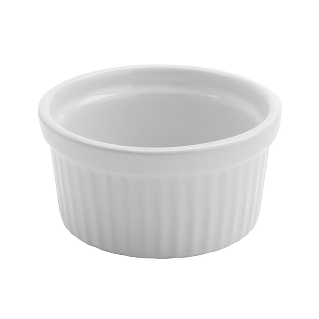 A small, round, 4 oz ceramic ramekin with vertical ridges on the exterior and a smooth interior sits on a white background. The rim is slightly thick and curved outward. The American Metalcraft ramekin is empty and designed for baking or serving.