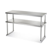 A stainless steel prep table with a rectangular top, open lower shelf, and sturdy legs supports both tiers. Its sleek, modern industrial design—enhanced by a double overshelf—is perfect for kitchens or workspaces.