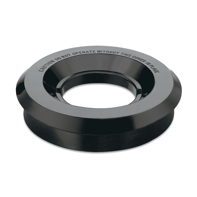 A black, circular plastic guard or outer lid with a wide rim and large central hole. Raised text around the rim reads: CAUTION DO NOT OPERATE WITHOUT THIS COVER IN PLACE. The item sits on a plain white background.