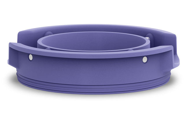 A purple, circular plastic Ellipse purple lid with threaded grooves at the base, two small metallic pins on the side, and an inner cylindrical section. The outer edge features raised grips for easy handling—possibly a Waring lid or cap component.