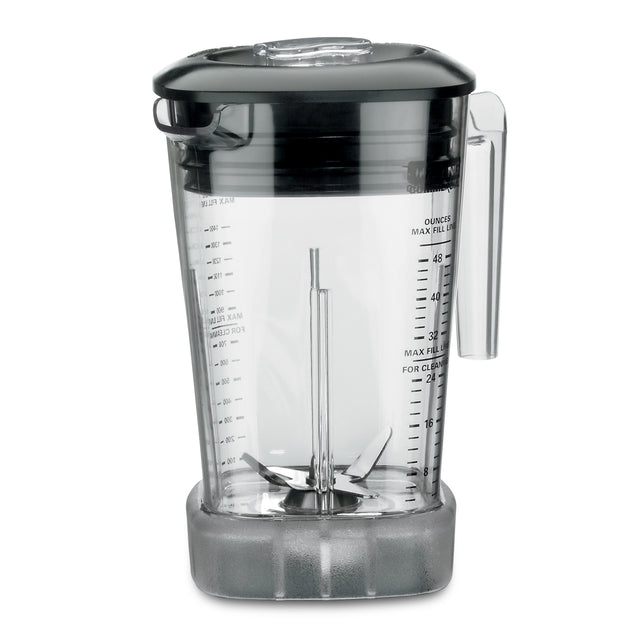 A transparent BPA Free Raptor Blender Container with a black lid and handle, marked with measurements in ounces and cups. Inside, sharp stainless steel blades attach to the base. The jar fits Xtreme MX blenders and sits on a sturdy, clear base against a plain white background.