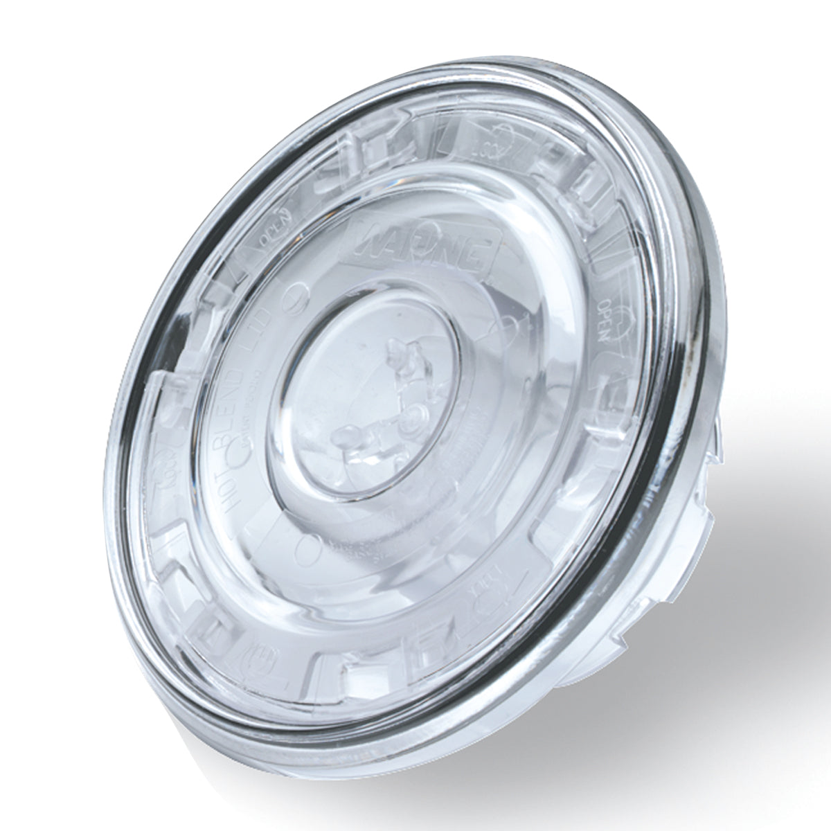 A clear, round Hot Blending Lid with a raised center and notched edges, designed to fit securely on a container. Compatible with Waring CB10B, the transparent lid features small embossed markings and a glossy finish, photographed on white.