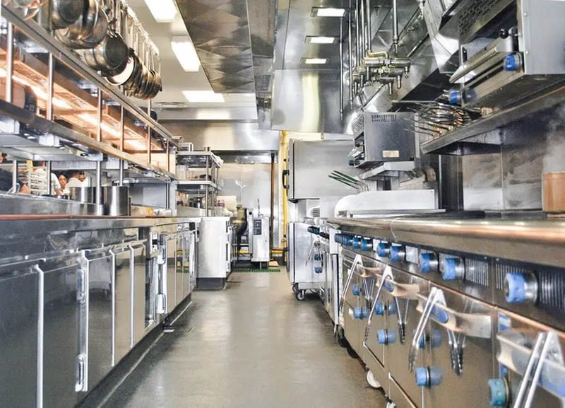 Stainless steel commercial kitchen designed with precision layout for optimal restaurant operations