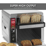 A Waring conveyor toaster toasts two slices of bread, with toast and a bagel on the tray below. The control panel displays power and heating lights, and a banner boasts “SUPER-HIGH OUTPUT: Toast Up to 450 Slices Per Hour for International Use.”.