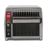 A high capacity commercial conveyor toaster with a stainless steel finish features a left-side control panel with buttons, a speed dial, and indicator lights. It includes a top metal wire rack, wide front opening for bread, and a slanted tray below.