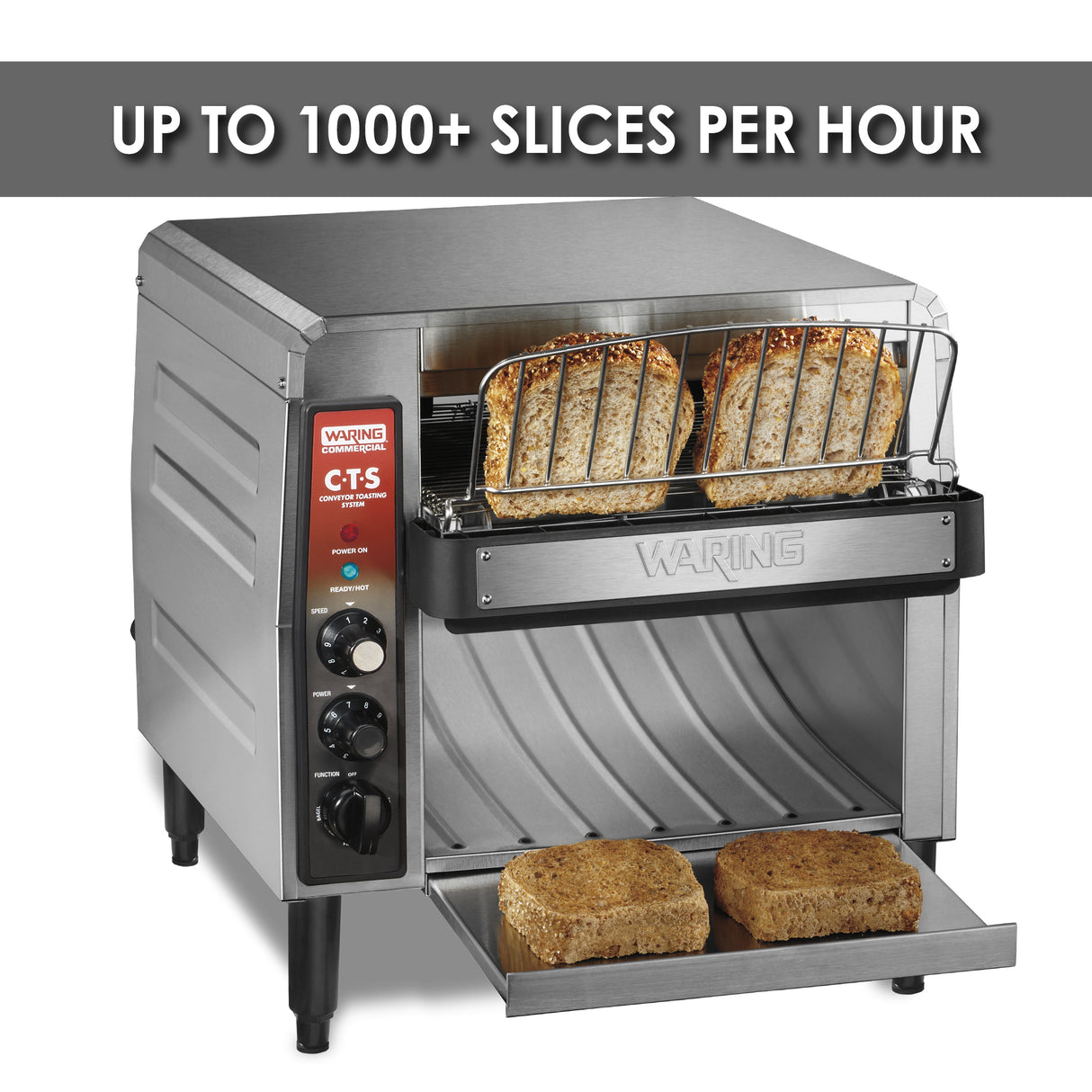 A stainless steel toaster with metal housing toasts four slices of bread. Two slices are in the rack, and two toasted slices rest on the pull-out tray. A sign above reads "UP TO 1000+ SLICES PER HOUR.” Control knobs and switches are on the left panel.
