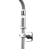 Close-up of a modern chrome shower fixture featuring a flexible hose, cylindrical connector, and wall-mount bracket attached to a vertical rod. The sleek, metallic design is reflective and highlights the fixture’s contemporary pre-rinse assembly style.