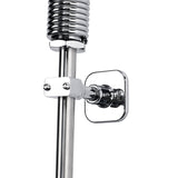 Close-up of a chrome-plated pre-rinse assembly shower pipe attached to the wall with a shiny, square wall mount. The pipe features a coiled section at the top and a clamp, reflecting light on its polished surface.