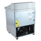 A commercial Empura refrigeration unit on wheels, shown from the back. The lower section reveals an open fan and compressor, with inspection stickers attached. The top section features a sloped metal cover typical of a mega top prep table.