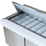 A stainless steel refrigerated sandwich prep table with its lid open displays multiple clear plastic food storage containers neatly arranged inside the top compartment. The unit features a white cutting board surface in front, showcasing Empura refrigeration quality.