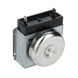 A metallic rotary appliance timer, such as the Magic Chef timer 70101200282, features a round silver dial with engraved markings, a rectangular black top housing with two gold-colored prongs, and a visible screw at the center.