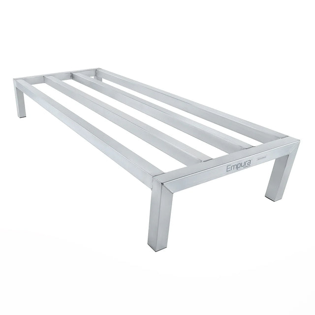 A heavy duty aluminum dunnage rack with four square legs and three horizontal slats, finished in silver. Freezer safe and labeled Empura, it’s designed for storing items off the floor in commercial kitchens or storage areas.