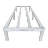 A heavy duty, stainless steel table frame by Empura with four legs and three wide, evenly spaced support bars across the top; similar to a dunnage rack. The aluminum-look finish gives it a sleek, modern appeal in the low, front-facing photo.