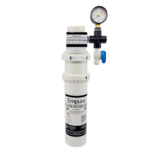 A white Empura Water Filtration System filter cartridge unit with a pressure gauge and attached valve. The label displays product details, while blue-and-white fittings are connected for installation. Features carbon based filtration for improved water quality.