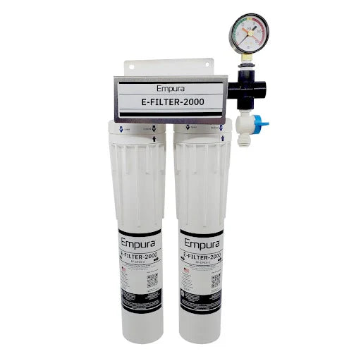A dual-cartridge Water Filtration System labeled “Empura E-FILTER-2000,” featuring two vertical white filter housings, a top mounting bracket, a pressure gauge, and a blue-handled shut-off valve—ideal for commercial ice machines or as a scale inhibitor.