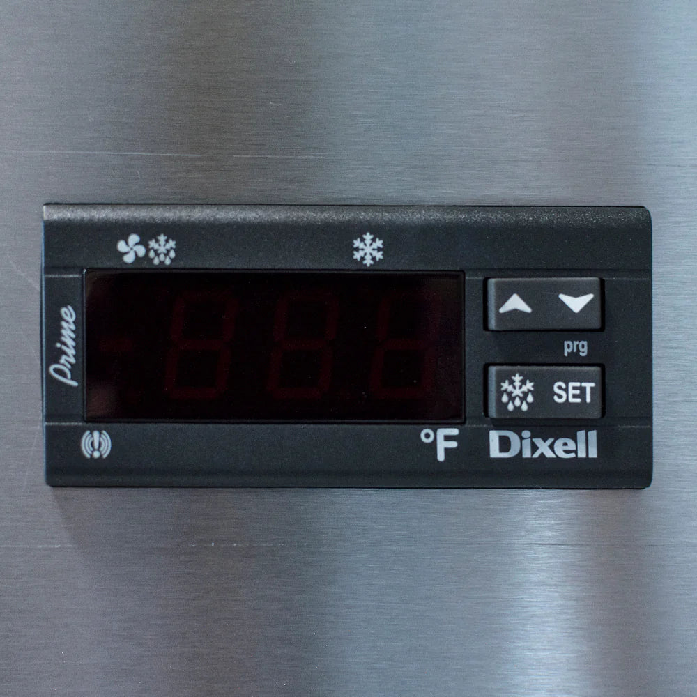 A close-up of a Dixell digital temperature controller on a stainless steel freezer, displaying “-88.8” on its red LED screen. The panel features arrow buttons, a “SET” button with a snowflake icon, °F for Fahrenheit, and the brand “Prime” on the left.