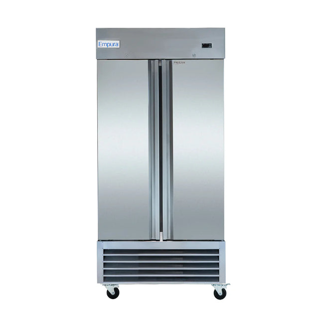 A commercial stainless steel Reach-In Freezer by Empura features double doors, vertical handles, a vented lower front panel, and smooth reflective surfaces. It sits on four caster wheels for easy mobility and has minimal detailing for a sleek look.