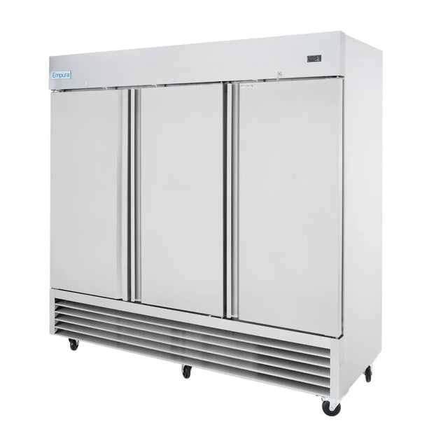 A large, stainless steel commercial refrigerator with three tall doors and vertical handles sits on six black caster wheels. The vent is at the bottom front, and the Empura brand name is on the top left corner. Its sleek, industrial look suits any professional kitchen.