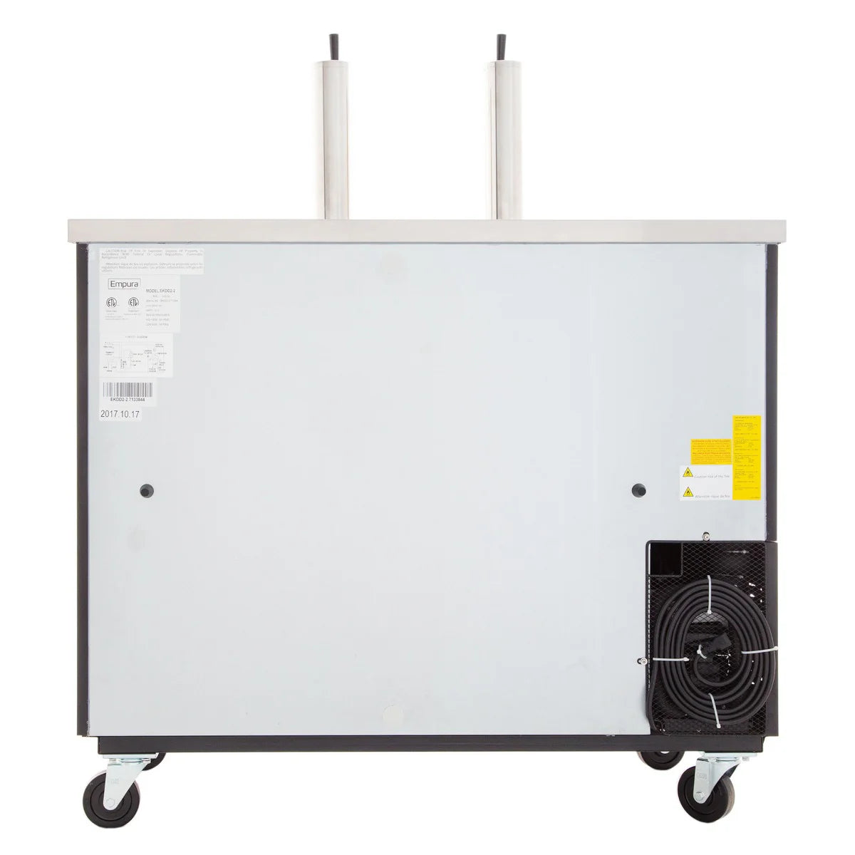 A commercial beer cooler with a stainless steel top, two tap towers, a silver front panel with labels and warnings, a visible black cooling unit at the bottom right, and four caster wheels—ideal as a direct draw beer dispenser.