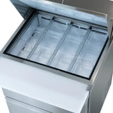 A top-down view of a stainless steel mega top prep table with its lid open, revealing twelve empty, clear plastic food pans in a 3x4 grid inside a refrigerated compartment. A white cutting board is attached to the front.