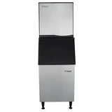 A tall, stainless steel commercial ice maker with black accents, labeled Empura. The unit features a large upper ice-making compartment for full cube ice and a lower bin for storage, all supported by four black legs in a sleek, industrial design.