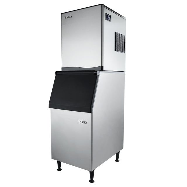 A tall, stainless steel commercial ice maker with a rectangular shape, black dispenser door, and digital display. The unit stands on four legs with a stainless steel ice bin and features the Empura brand name on its modern, industrial front panel.